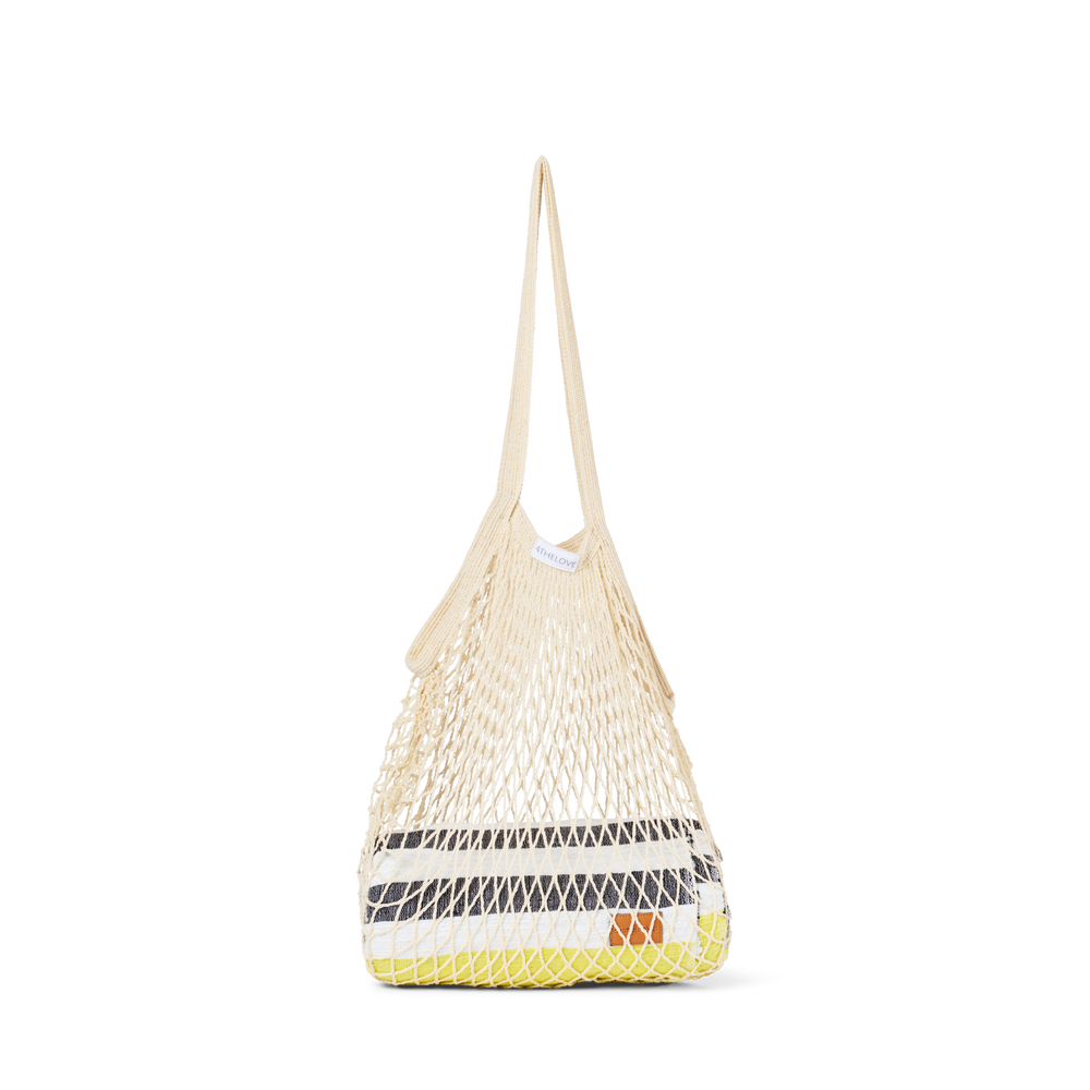 Woven bag with geometric pattern on a white background