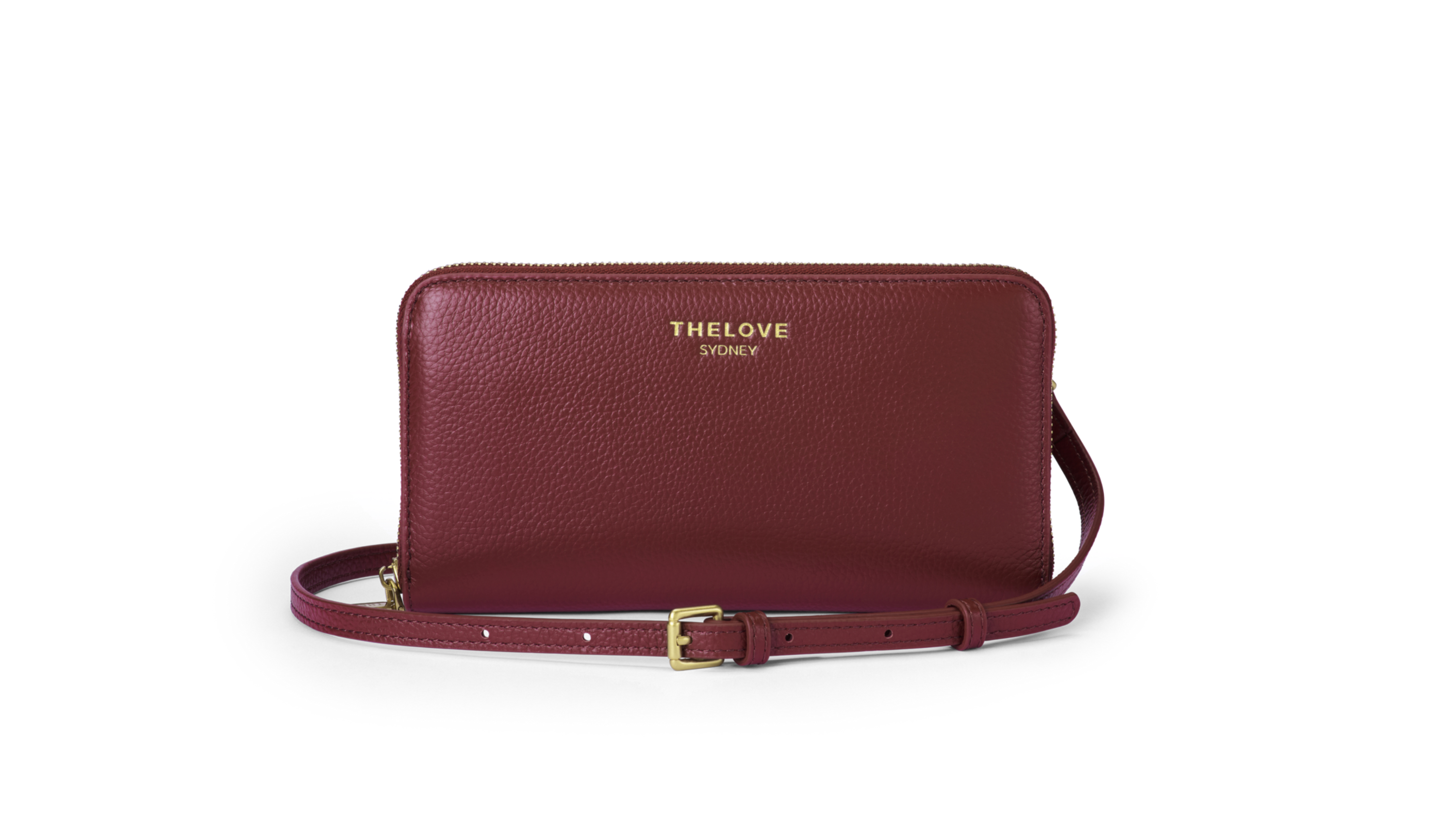 Maroon leather clutch bag with gold strap on a white background