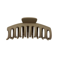 Beige hair clip on a white background
